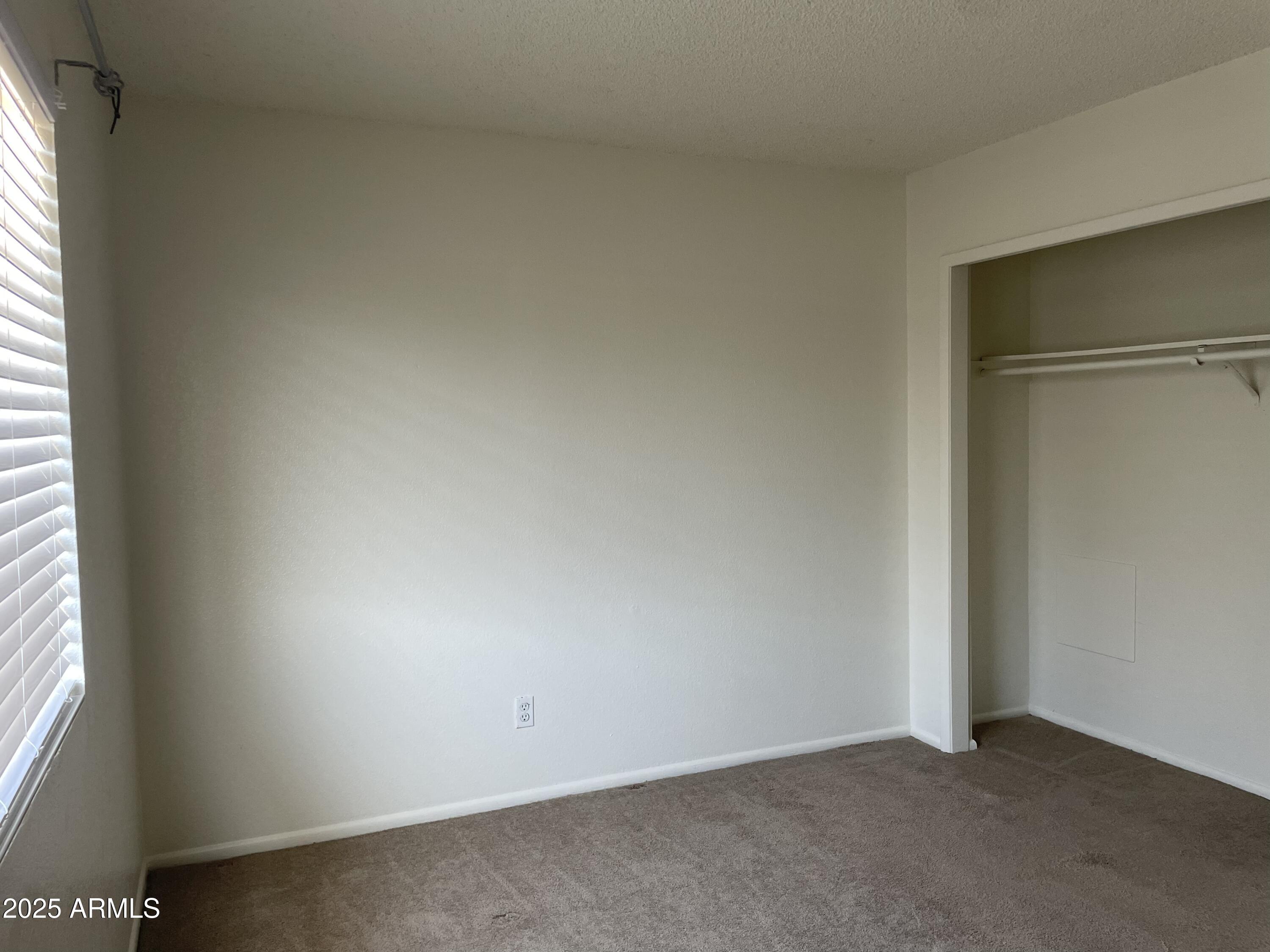 143 South Mountain Road, Unit 1 Apache Junction, AZ 85120 - Photo 12 of 17 an empty room with a window