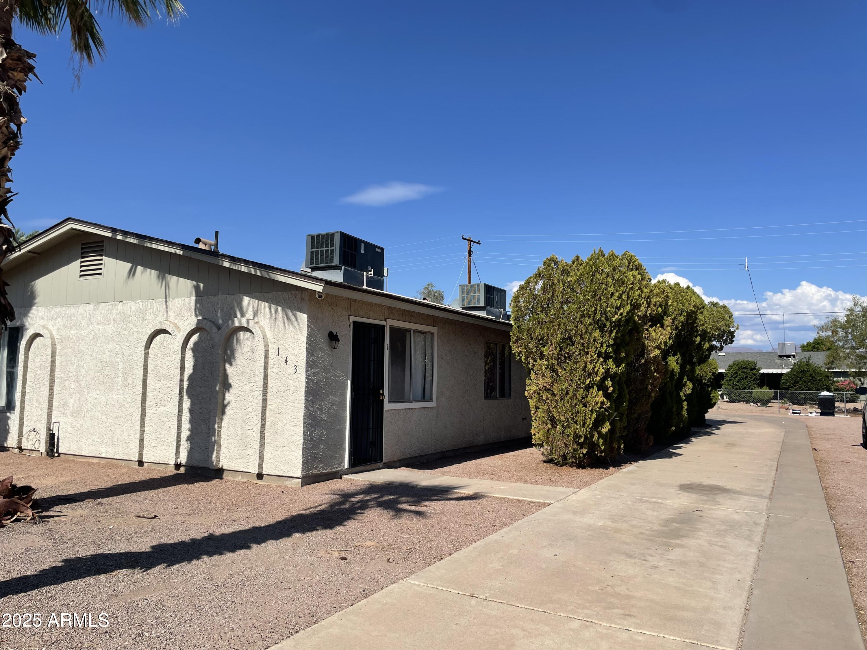 143 South Mountain Road, Unit 1 Apache Junction, AZ 85120 - Photo 17 of 17 a view of a house with a outdoor space