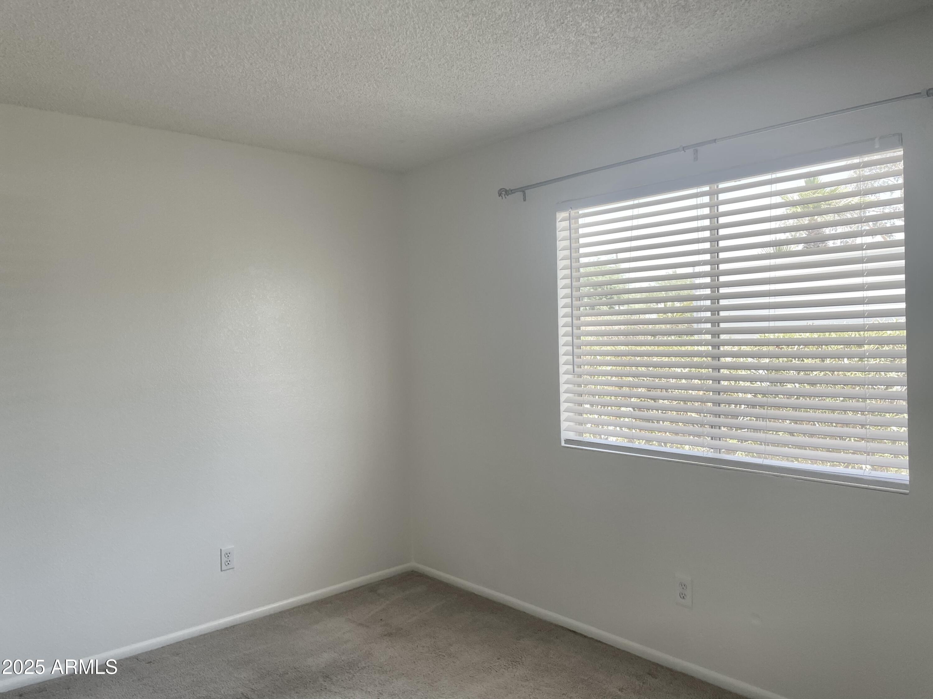 143 South Mountain Road, Unit 1 Apache Junction, AZ 85120 - Photo 5 of 17 a view of an empty room with a window