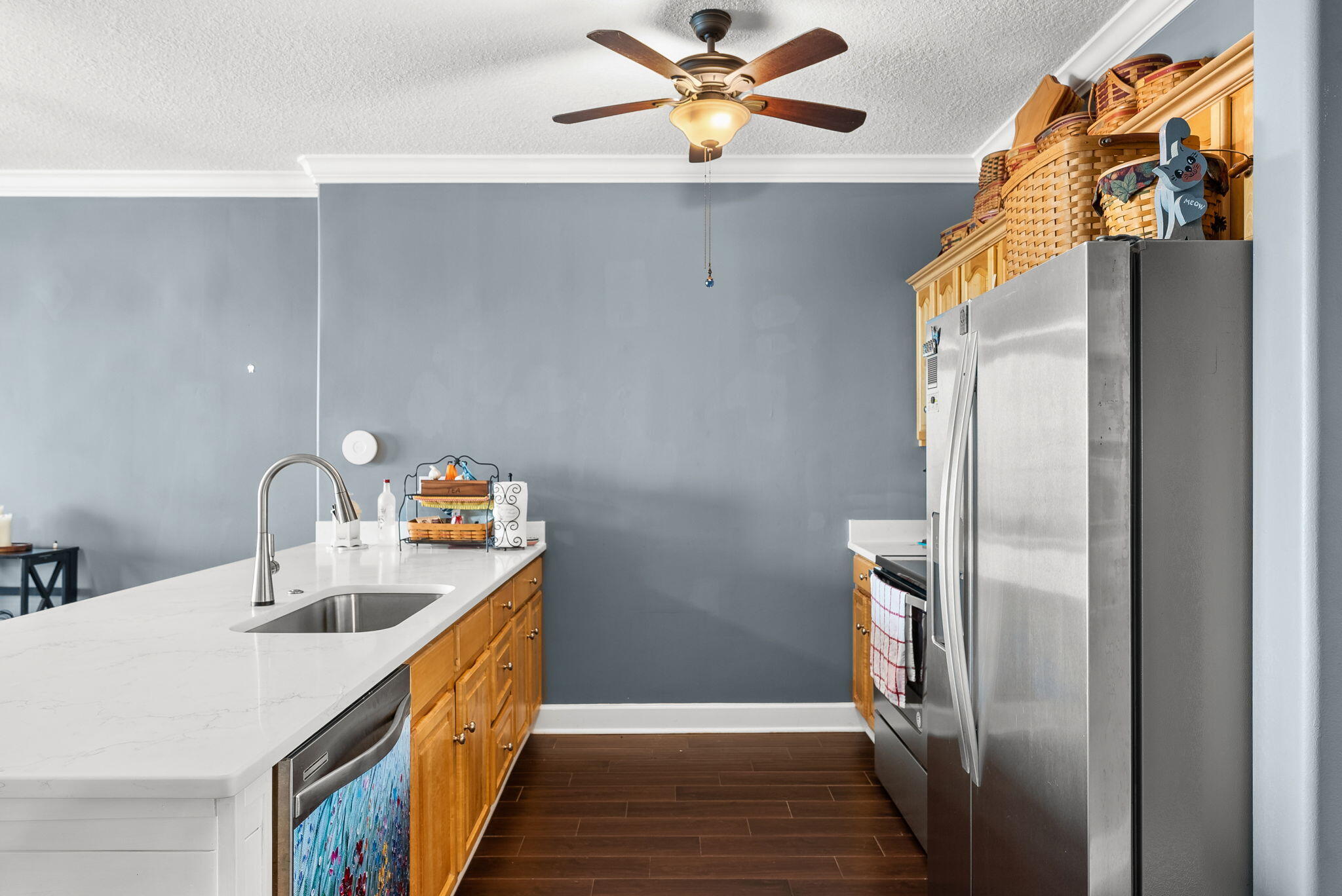 14415 Front Beach Road, Unit 1305 Panama City Beach, FL 32413 - Photo 12 of 47 a kitchen with stainless steel appliances a sink a refrigerator and cabinets