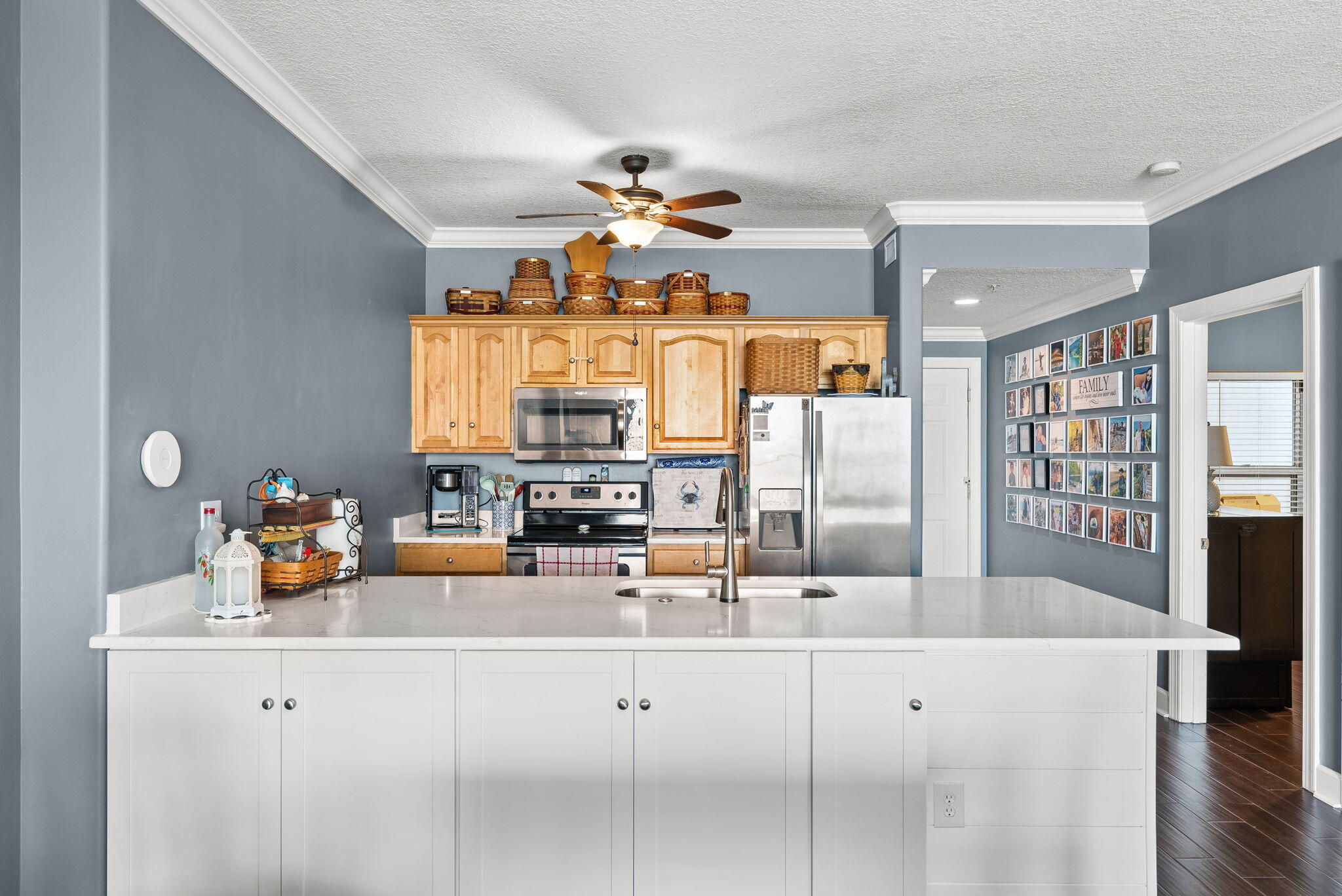 14415 Front Beach Road, Unit 1305 Panama City Beach, FL 32413 - Photo 13 of 47 a kitchen with stainless steel appliances kitchen island granite countertop a sink and cabinets