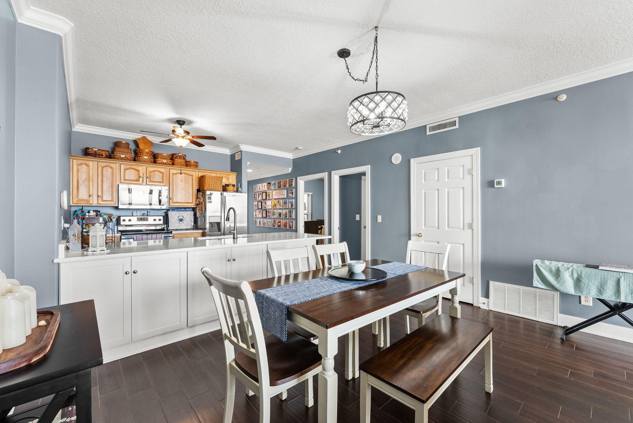 14415 Front Beach Road, Unit 1305 Panama City Beach, FL 32413 - Photo 16 of 47 a view of a dining room with furniture window and wooden floor