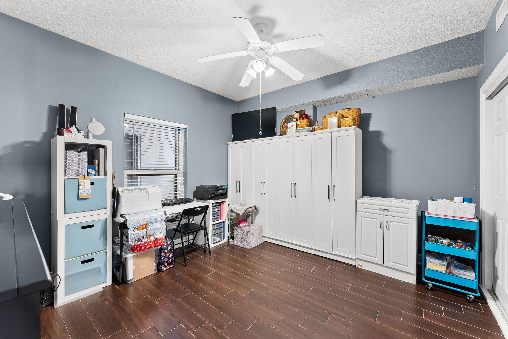 14415 Front Beach Road, Unit 1305 Panama City Beach, FL 32413 - Photo 20 of 47 a view of a workspace with furniture and wooden floor