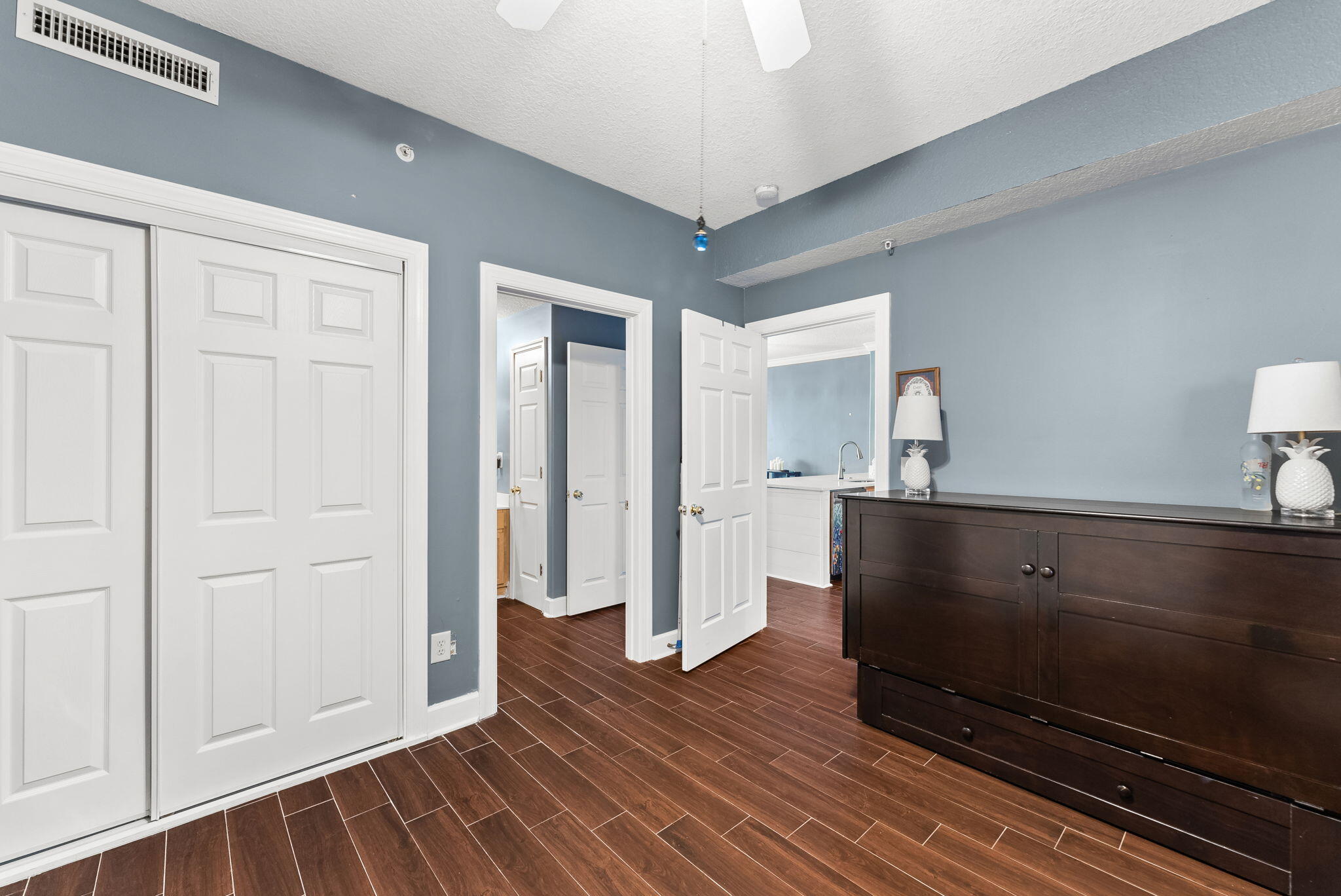 14415 Front Beach Road, Unit 1305 Panama City Beach, FL 32413 - Photo 21 of 47 a view of wooden floor and windows in a room