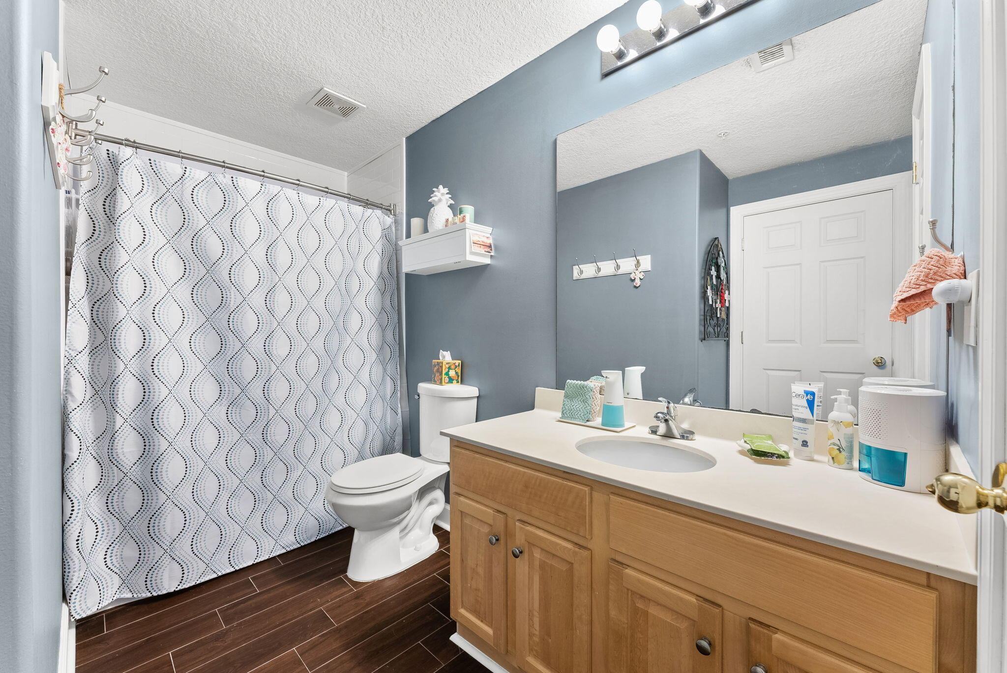 14415 Front Beach Road, Unit 1305 Panama City Beach, FL 32413 - Photo 22 of 47 a bathroom with a sink toilet and shower