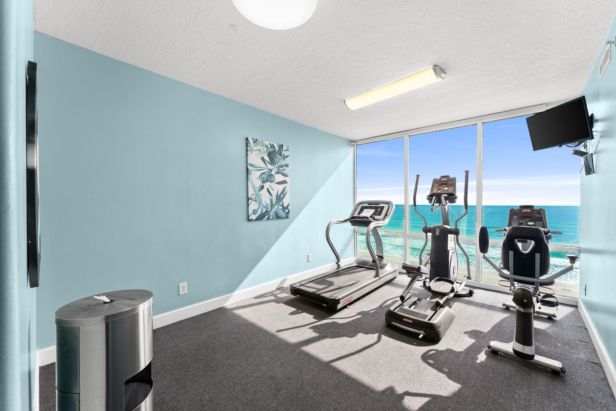 14415 Front Beach Road, Unit 1305 Panama City Beach, FL 32413 - Photo 31 of 47 a room with gym equipment and a view of living room
