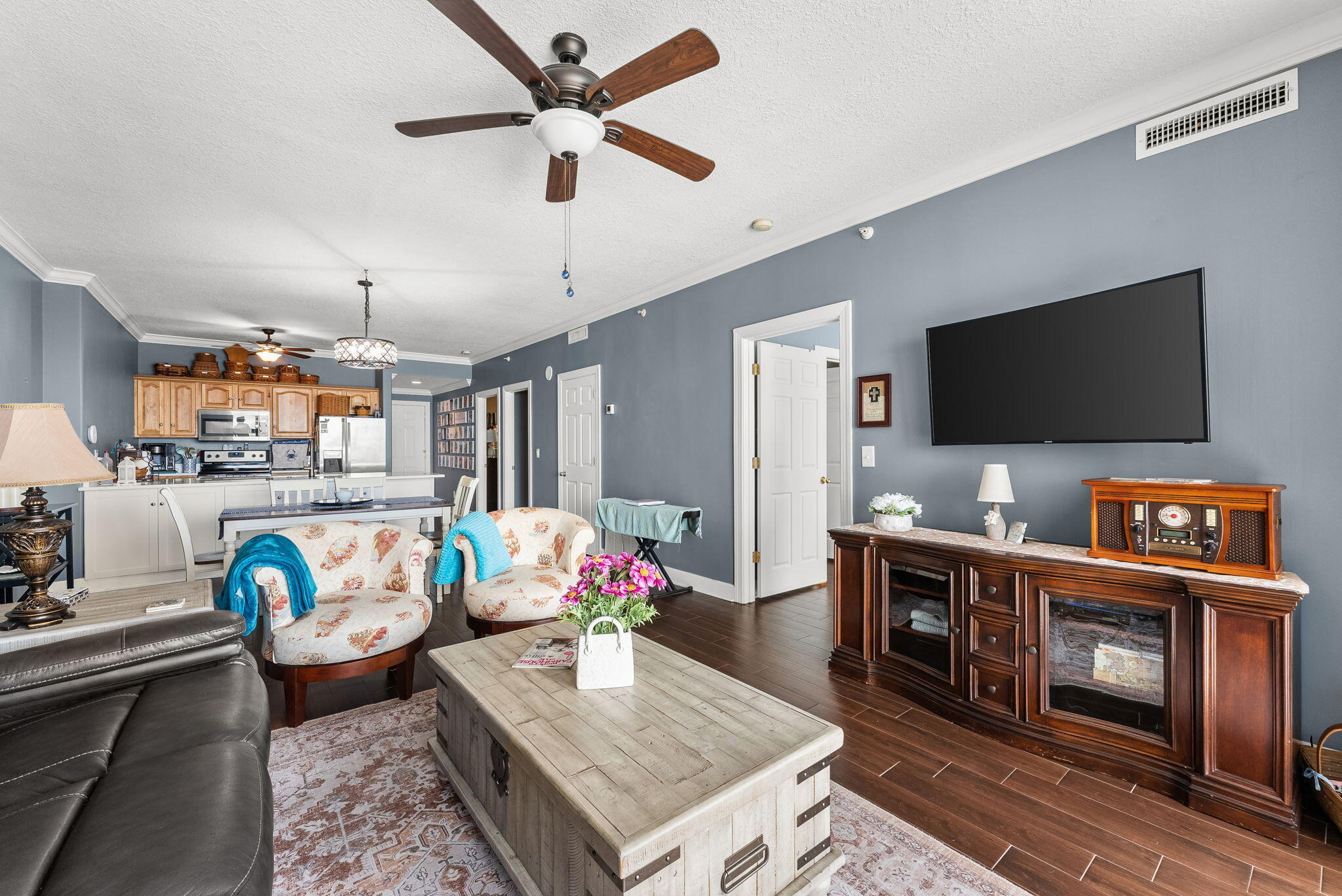 14415 Front Beach Road, Unit 1305 Panama City Beach, FL 32413 - Photo 8 of 47 a living room with furniture and a flat screen tv