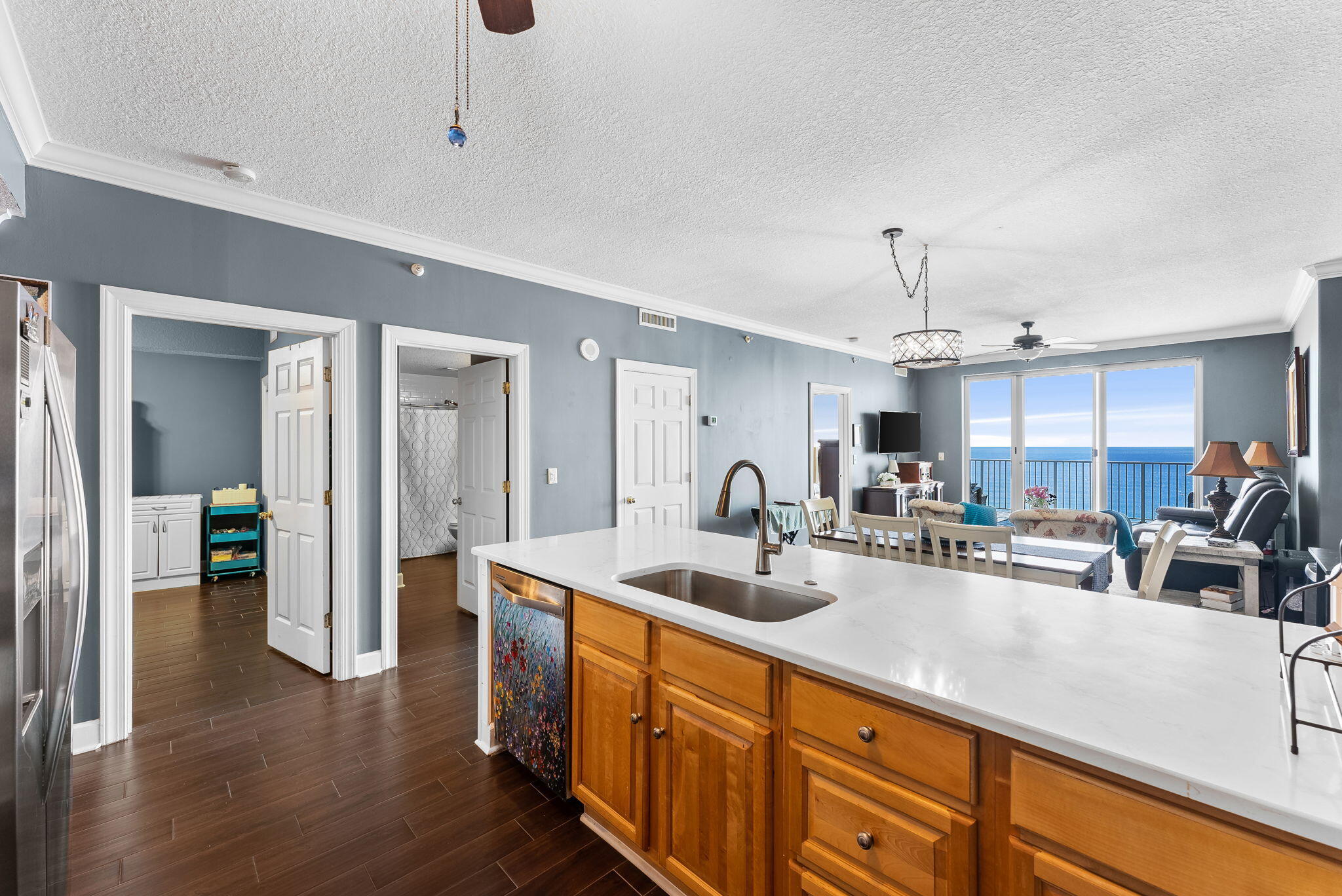 14415 Front Beach Road, Unit 1305 Panama City Beach, FL 32413 - Photo 9 of 47 a kitchen with sink and refrigerator