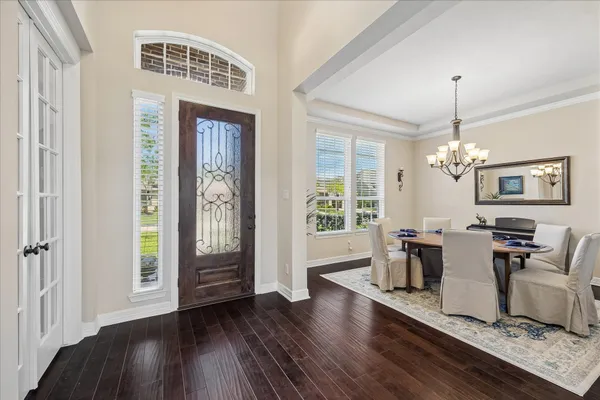 a living room with hard wood floors and a window