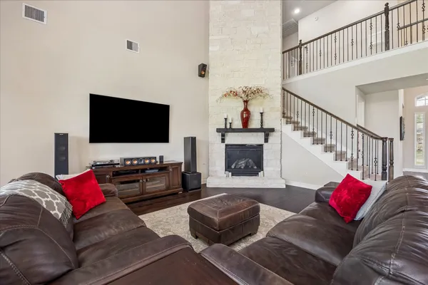 a spacious bedroom with a bed and a large window with balcony view