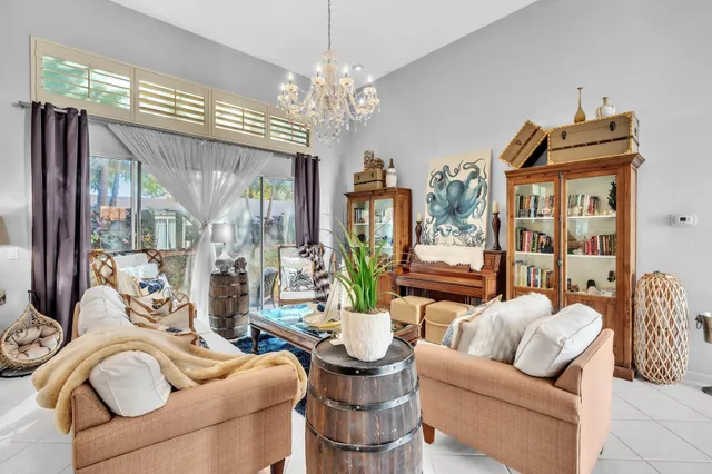 a dining room with furniture and chandelier