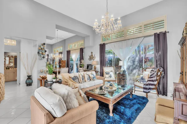 a dining room with furniture and chandelier
