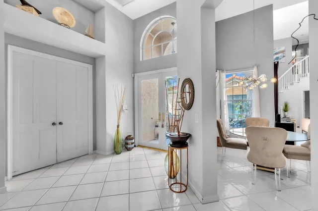 a kitchen with granite countertop a sink cabinets and refrigerator