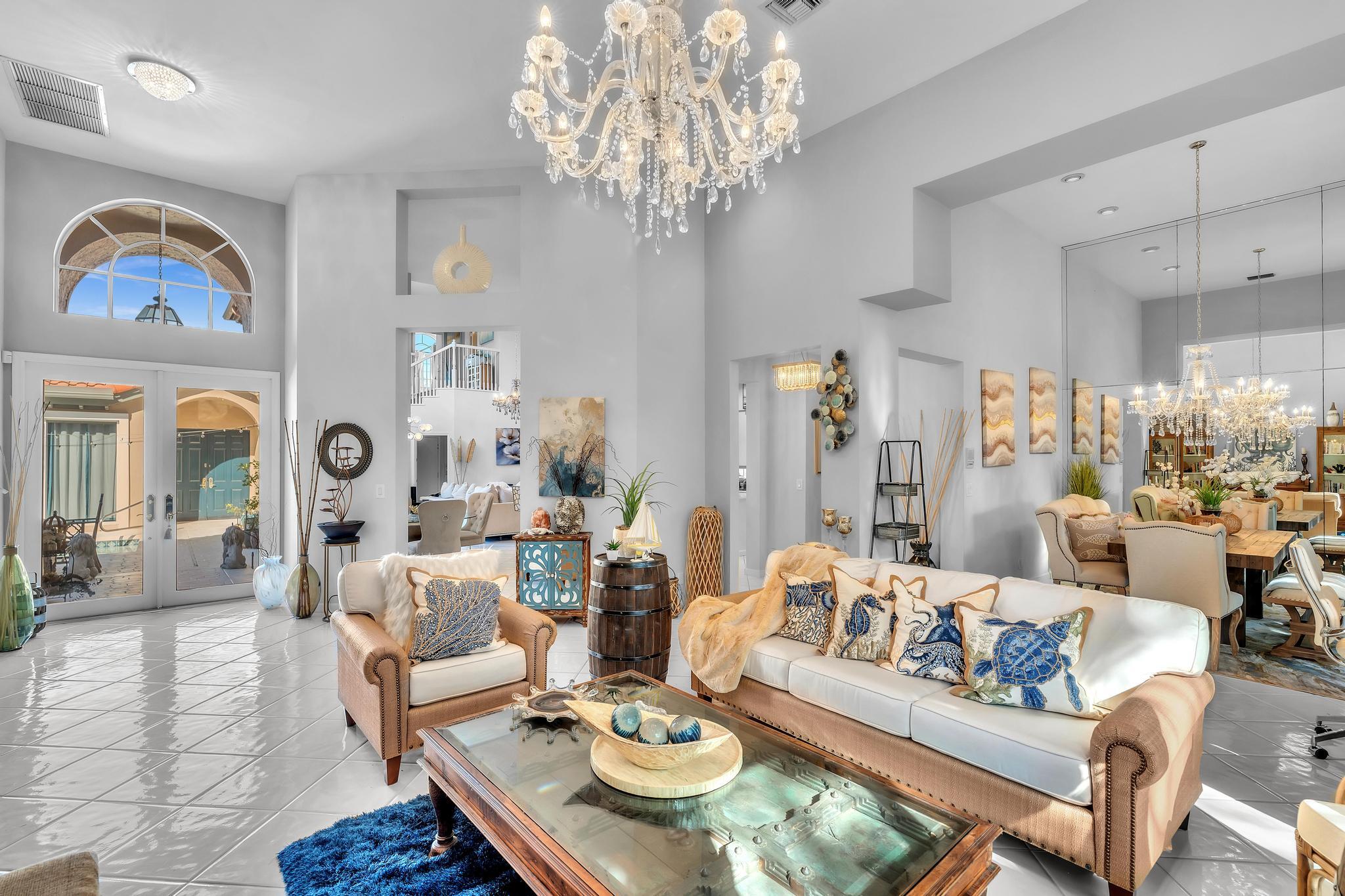 6230 Northwest 23rd Street Boca Raton, FL 33434 - Photo 17 of 90 a living room with furniture chandelier and a chandelier