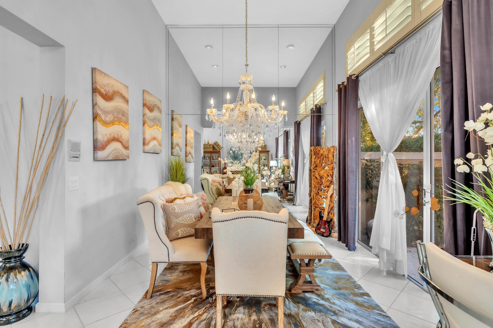 6230 Northwest 23rd Street Boca Raton, FL 33434 - Photo 20 of 90 a view of a dining room with furniture and a chandelier