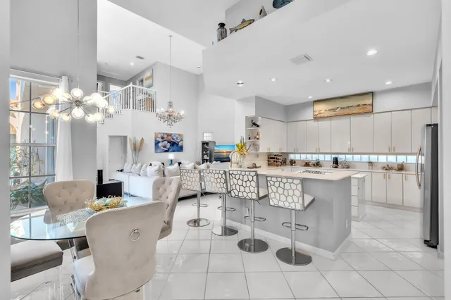 a spacious bedroom with bed and a chandelier