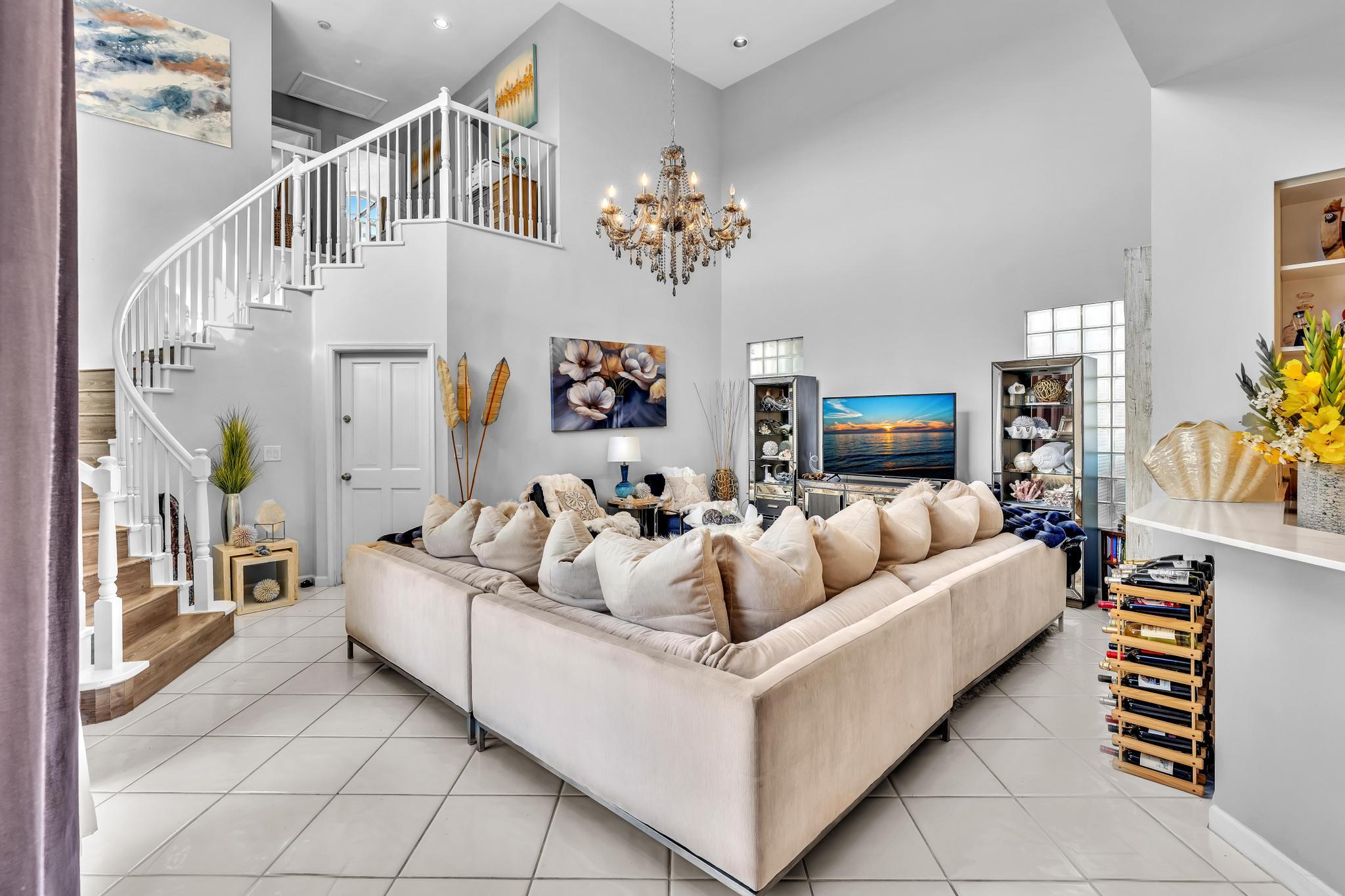 6230 Northwest 23rd Street Boca Raton, FL 33434 - Photo 30 of 90 a living room with furniture and a chandelier