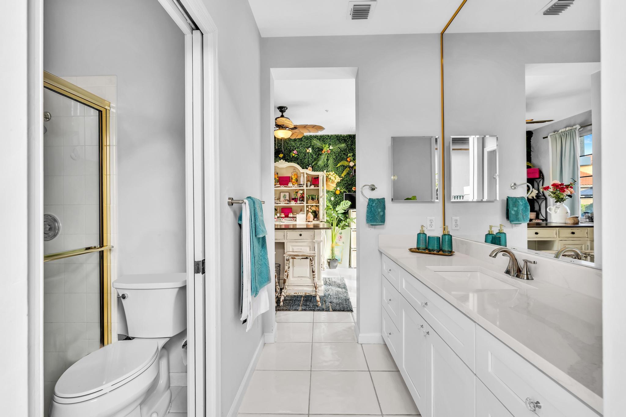 6230 Northwest 23rd Street Boca Raton, FL 33434 - Photo 55 of 90 a bathroom with a sink a toilet and shower