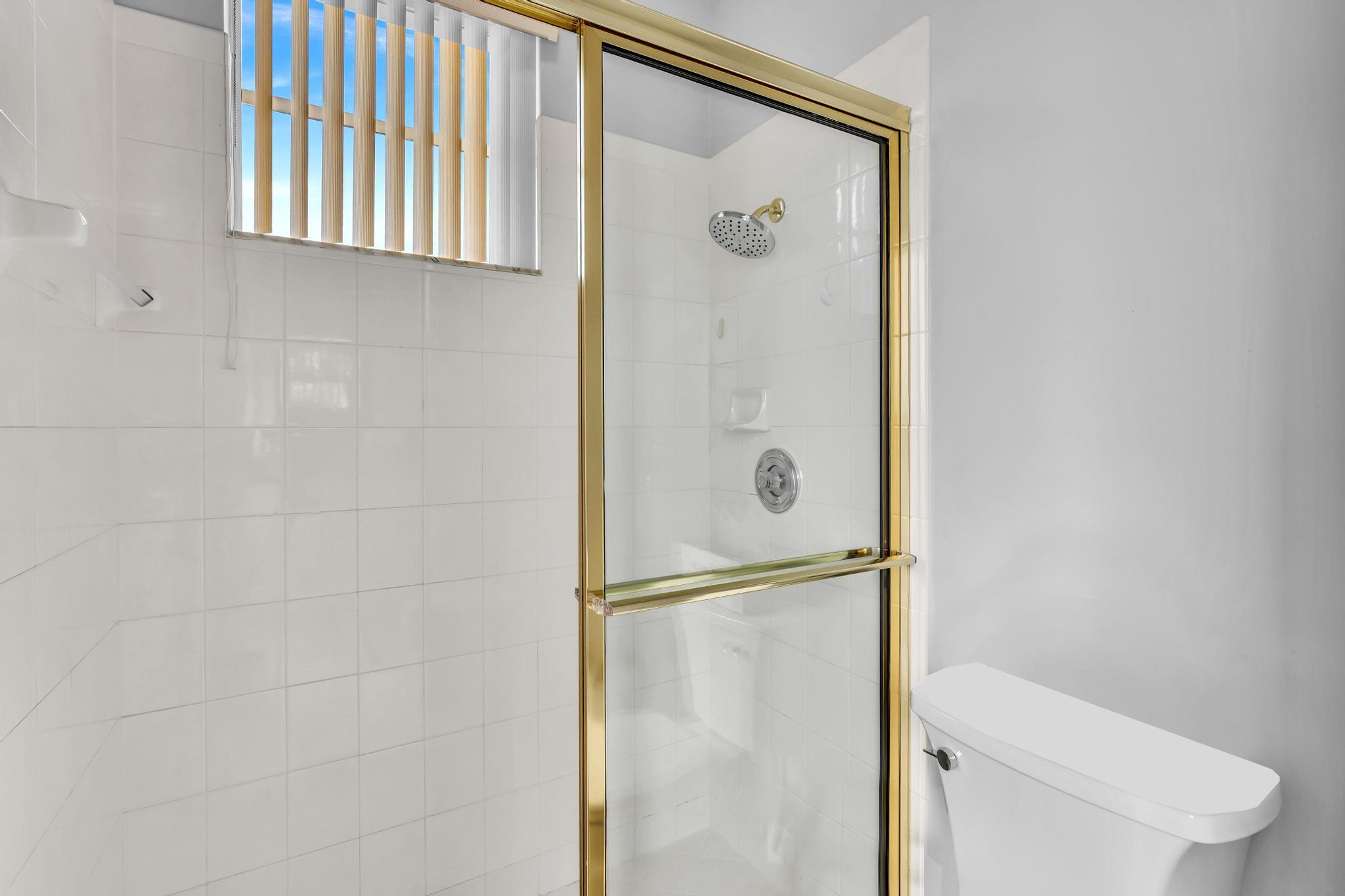 6230 Northwest 23rd Street Boca Raton, FL 33434 - Photo 56 of 90 a bathroom with a shower and a toilet