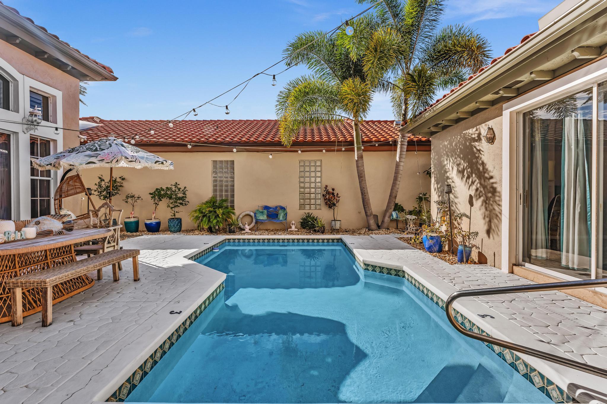 6230 Northwest 23rd Street Boca Raton, FL 33434 - Photo 58 of 90 a view of outdoor space yard deck patio and outdoor kitchen