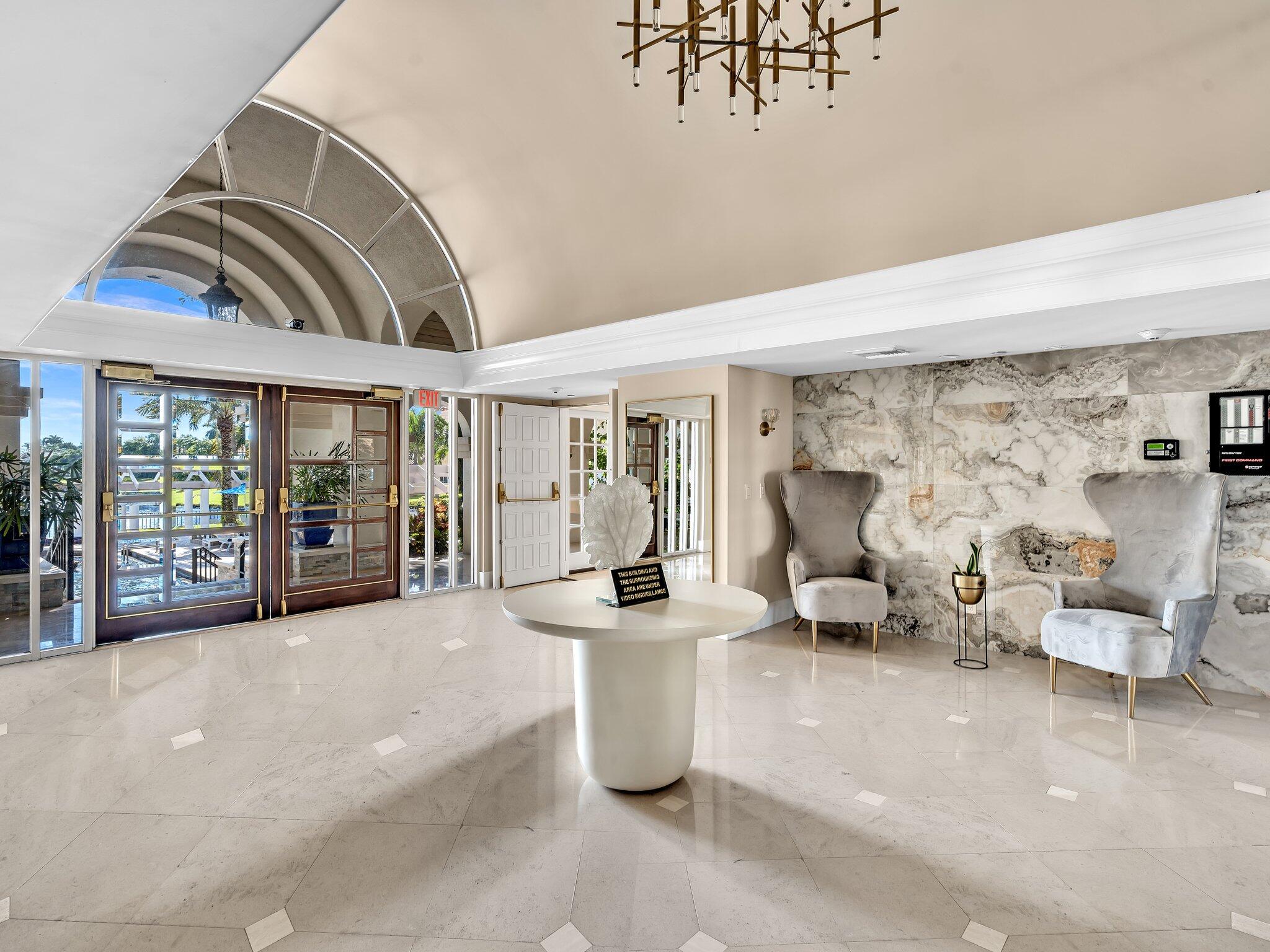 6230 Northwest 23rd Street Boca Raton, FL 33434 - Photo 78 of 90 a lobby with furniture and floor to ceiling window