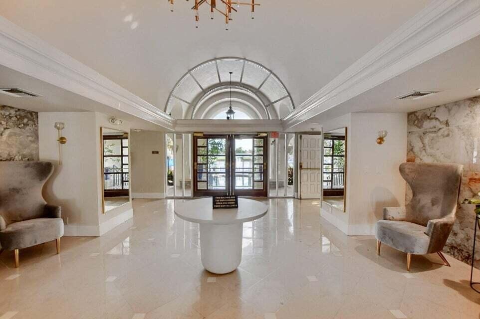6230 Northwest 23rd Street Boca Raton, FL 33434 - Photo 79 of 90 a living room with furniture and a large window