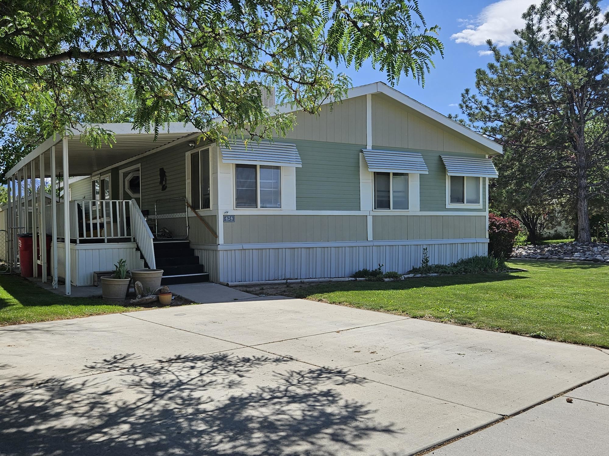 435 32 Road, Unit 424 Clifton, CO 81520 - Photo 3 of 21 a view of a house with a yard