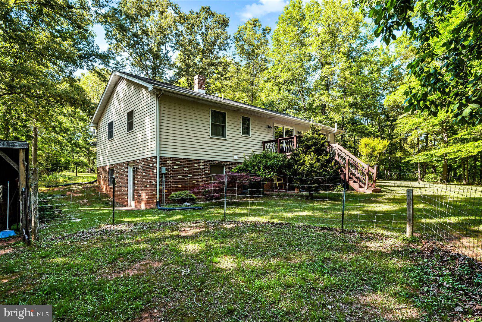 804 Buggy Lane Rochelle, VA 22738 - Photo 36 of 50 a view of a house with a yard and plants