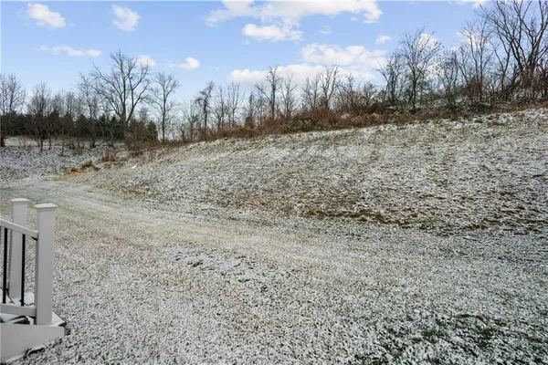 a view of a yard covered with snow