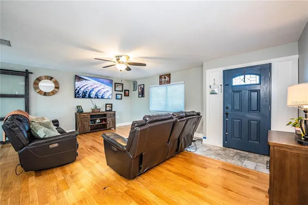 a dining room with furniture and a kitchen