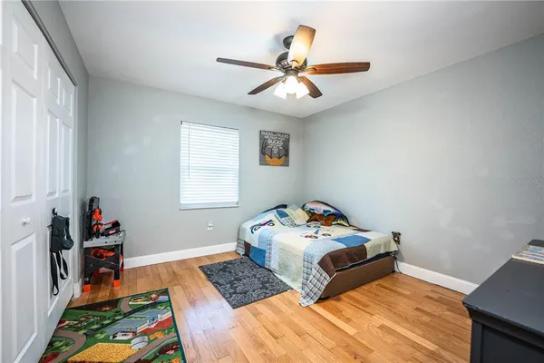 a front view of a house with a yard and lake view