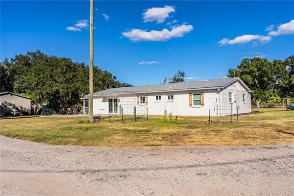 a view of a house with a big yard