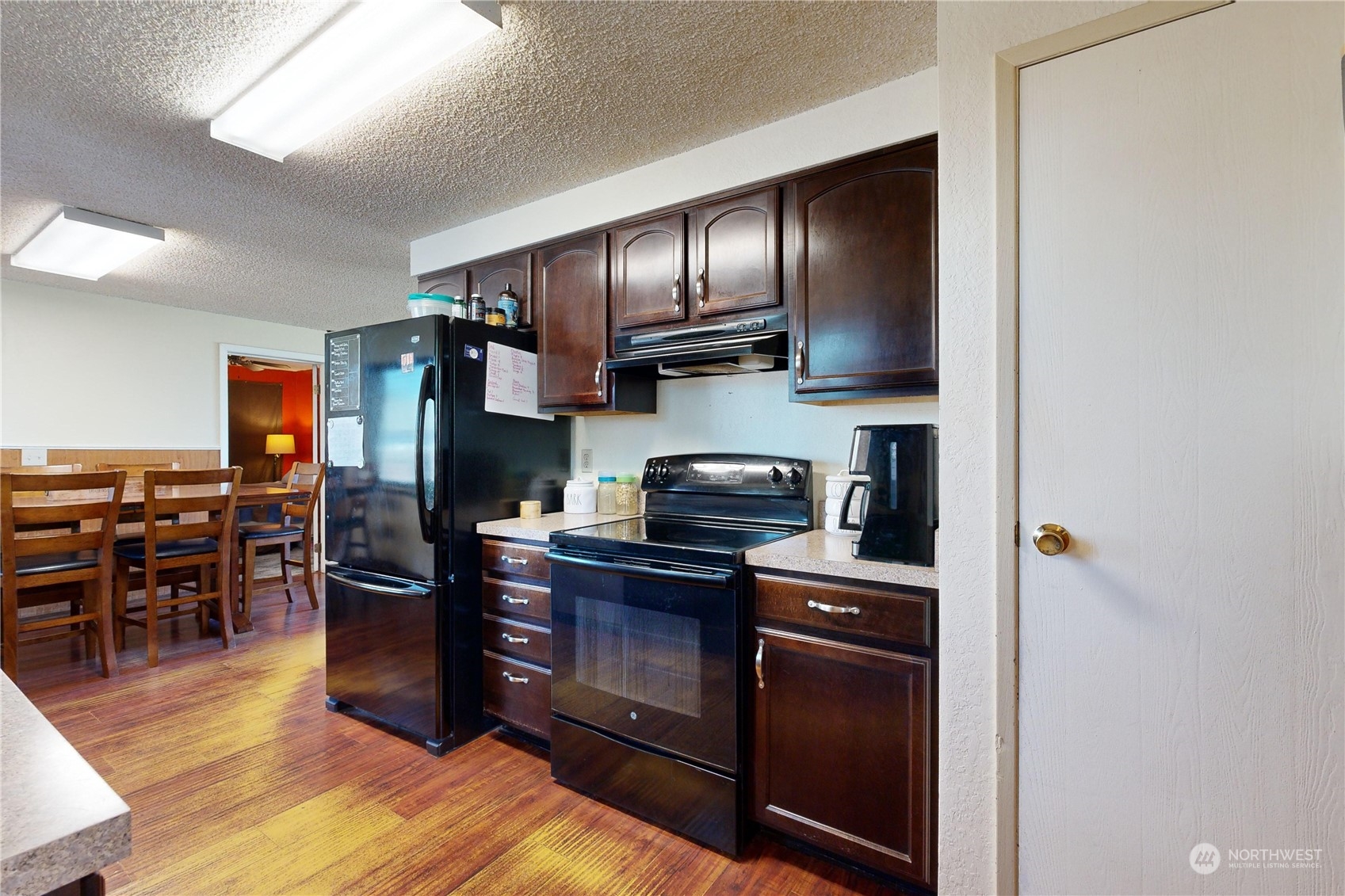 289 Main Street Touchet, WA 99360 - Photo 12 of 40 a kitchen with stainless steel appliances granite countertop a stove refrigerator and dining table