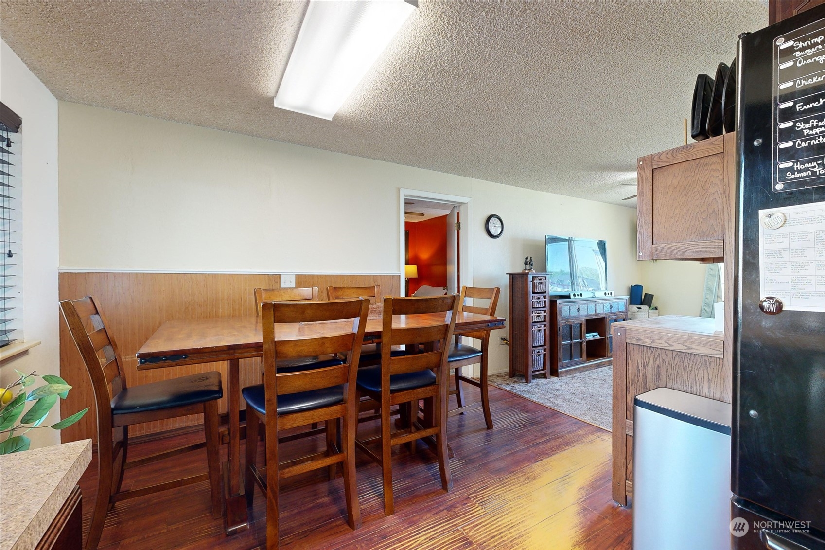 289 Main Street Touchet, WA 99360 - Photo 13 of 40 a view of a dining room with furniture and wooden floor
