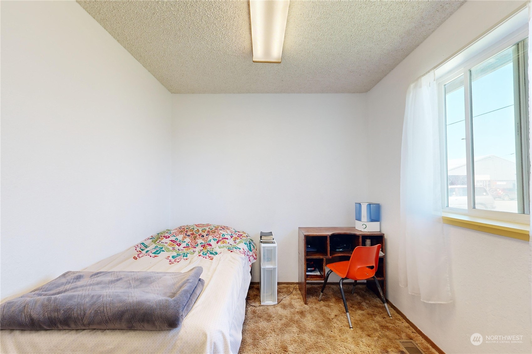 289 Main Street Touchet, WA 99360 - Photo 19 of 40 a bedroom with a bed and wooden floor