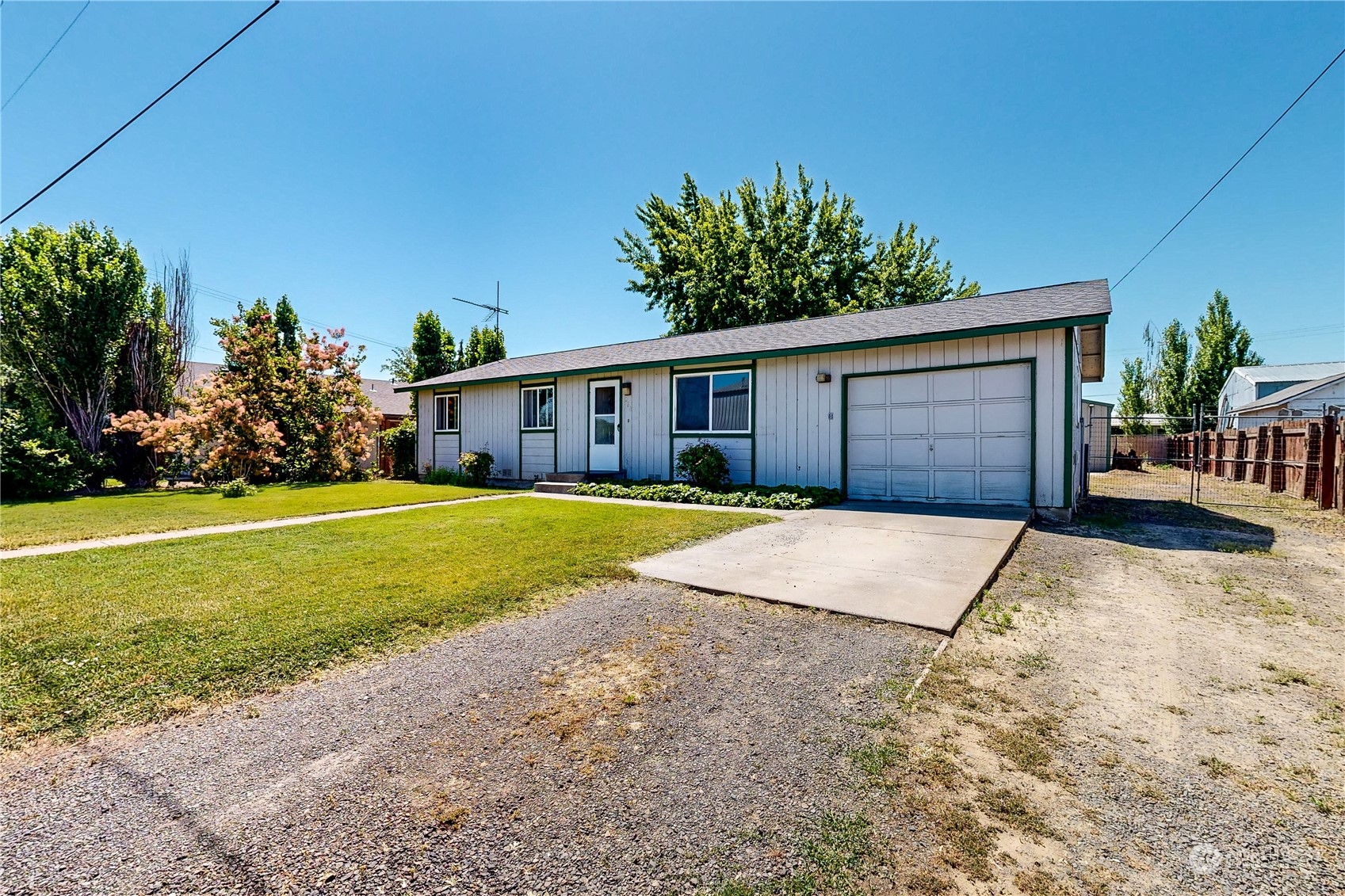 289 Main Street Touchet, WA 99360 - Photo 38 of 40 a house with a yard and a large parking space