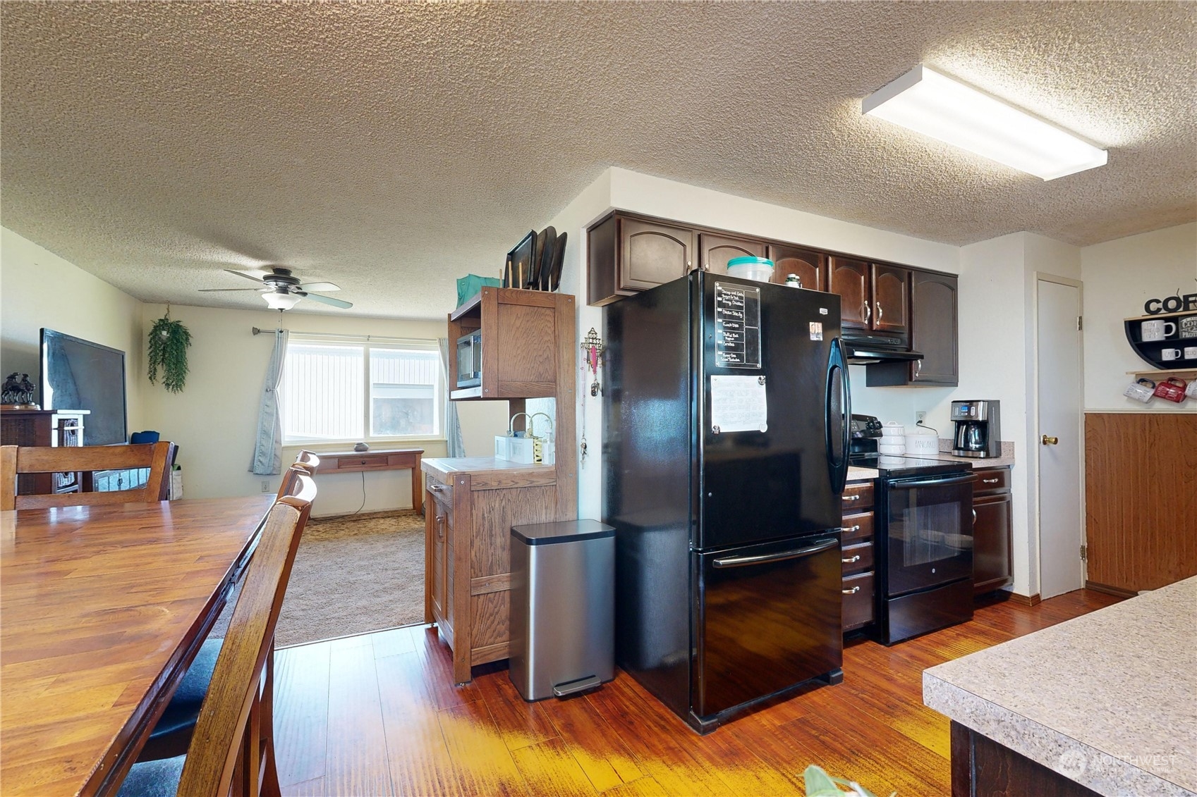289 Main Street Touchet, WA 99360 - Photo 7 of 40 a kitchen with stainless steel appliances granite countertop a refrigerator stove top oven dining table and chairs