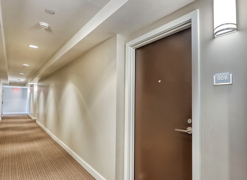 100 Station Landing, Unit 906 Medford, MA 02155 - Photo 17 of 28 a view of a hallway with entryway