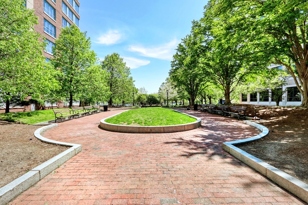 100 Station Landing, Unit 906 Medford, MA 02155 - Photo 24 of 28 a view of a swimming pool with a yard