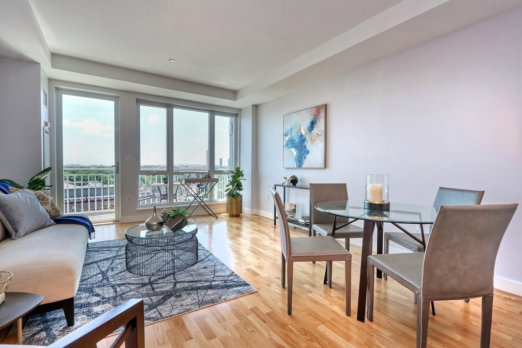 100 Station Landing, Unit 906 Medford, MA 02155 - Photo 6 of 28 a living room with furniture and a large window