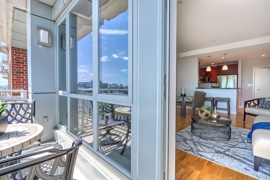 100 Station Landing, Unit 906 Medford, MA 02155 - Photo 9 of 28 a view of a living room and dining room