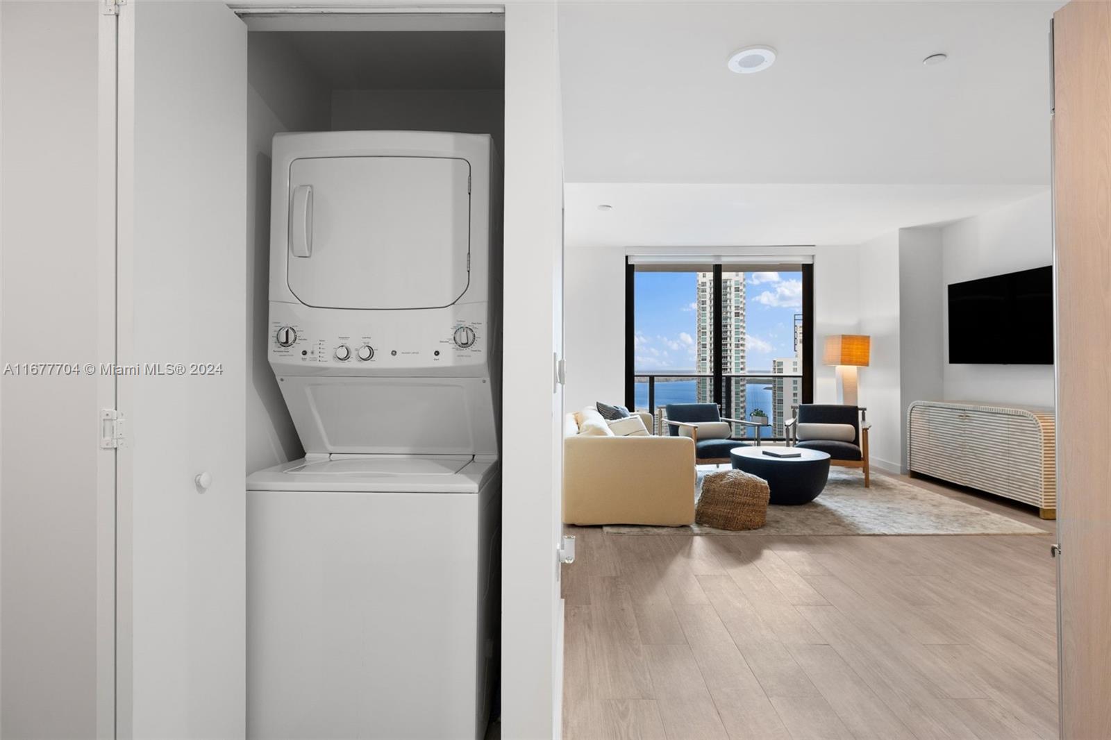 45 Southwest 9th Street, Unit 3802 Miami, FL 33130 - Photo 12 of 40 a living room with furniture and a flat screen tv