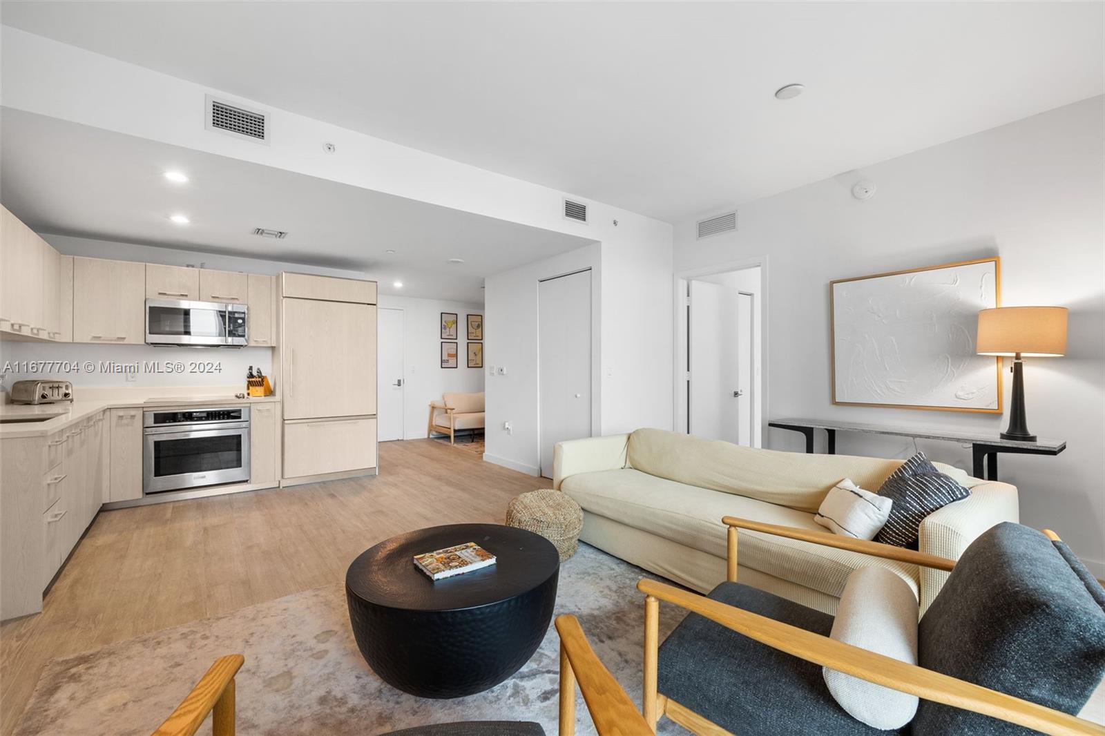 45 Southwest 9th Street, Unit 3802 Miami, FL 33130 - Photo 20 of 40 a living room with furniture and a fireplace