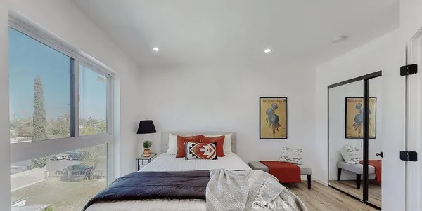 a bathroom with a shower sink and mirror