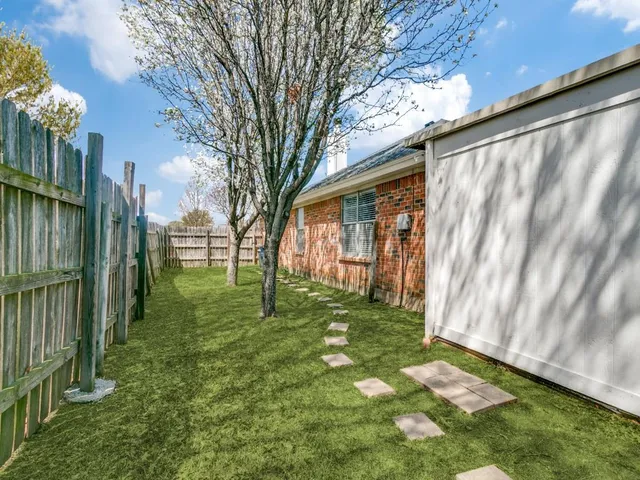 a backyard of a house with lots of green space
