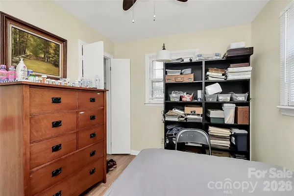 a bedroom with a bed and furniture