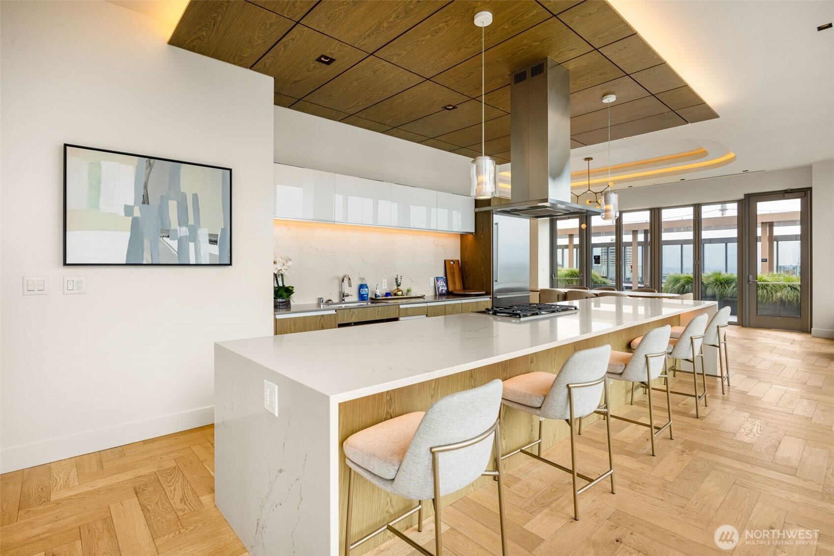 800 Columbia Street, Unit 808 Seattle, WA 98104 - Photo 9 of 38 a dining hall with stainless steel appliances kitchen island granite countertop a dining table and chairs
