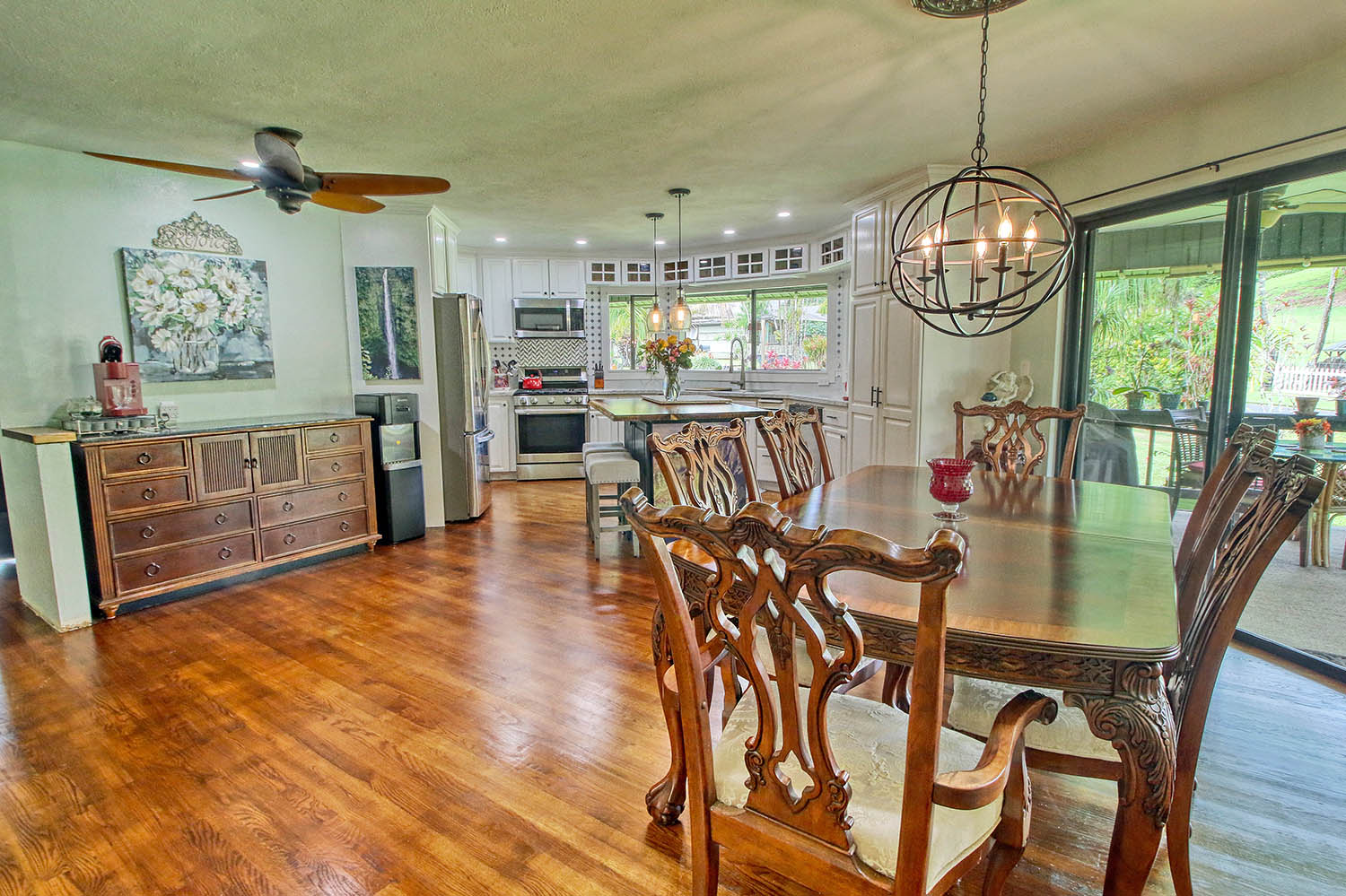 6581 Puupilo Road Kapaa, HI 96746 - Photo 9 of 24 a view of a dining room with furniture a chandelier and wooden floor