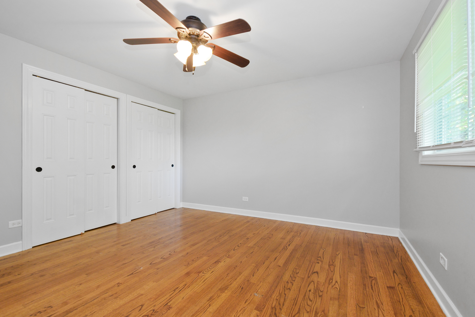 433 Hackberry Road Frankfort, IL 60423 - Photo 11 of 27 wooden floor in an empty room with a window