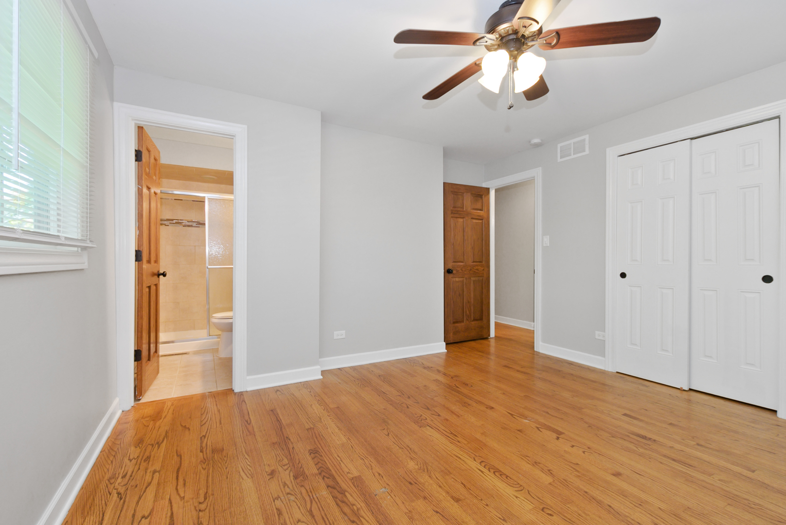 433 Hackberry Road Frankfort, IL 60423 - Photo 13 of 27 a view of empty room with wooden floor and fan